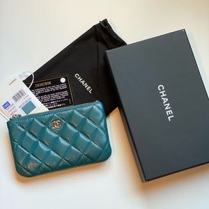Authentic Chanel small O-Case Caviar